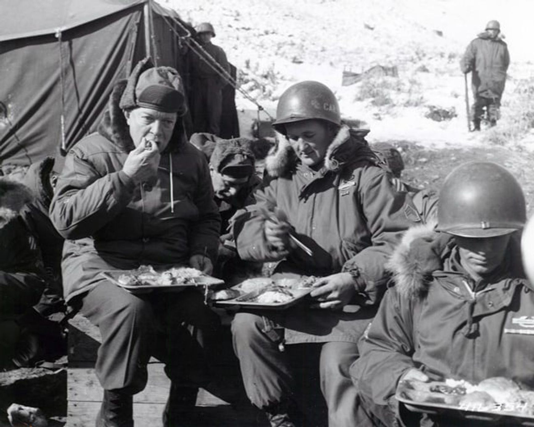 U.S. President-elect Dwight D. Eisenhower (left) dining with American soldiers in Korea. December 1952