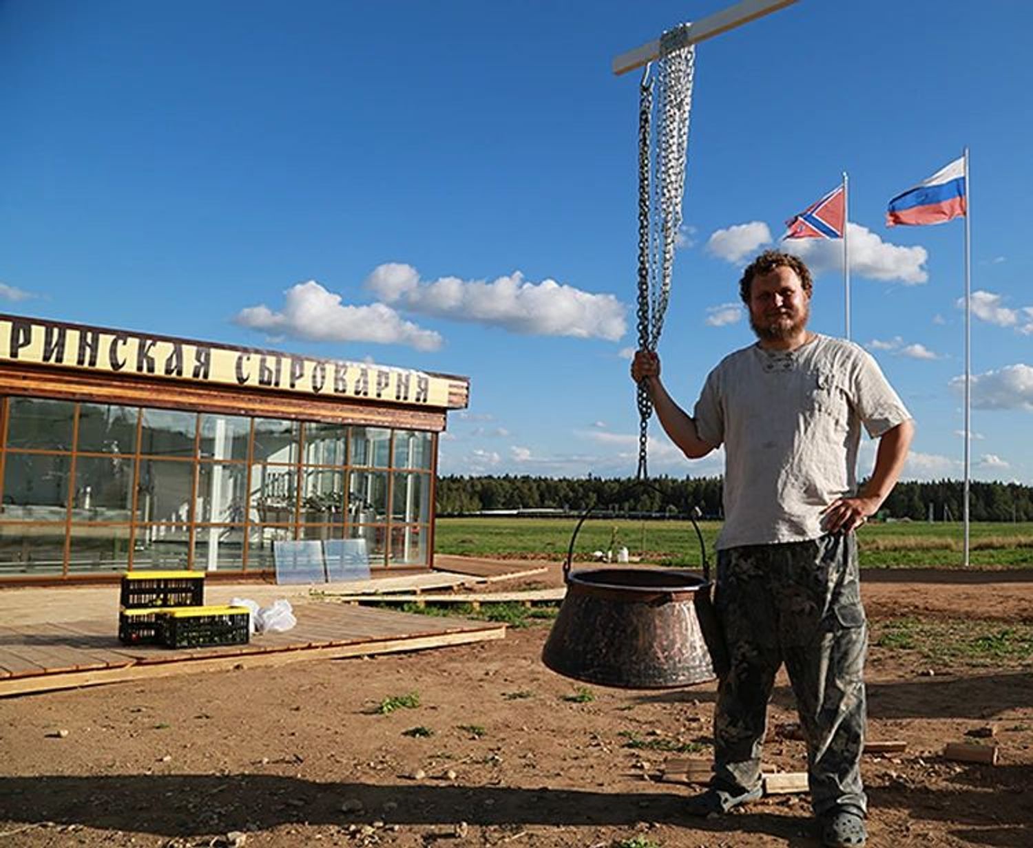 Two flags can be seen flying above Sirota’s cheese factory — Russia’s state flag and the flag of “Novorossiya.”